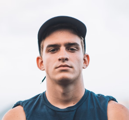 Man in cap looking serious